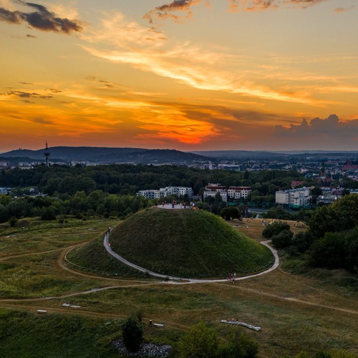 Sunset over a grassy mound on the edge of Krakow